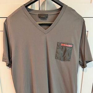 Prada v-neck stretch cotton shirt in gray with contrast embroidered nylon pocket